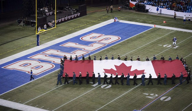 A Canadian flag is carried over the Buffalo Bills end zone before the Bills play the Atlanta Falcons in NFL action in Toronto, Sunday December 1, 2013.