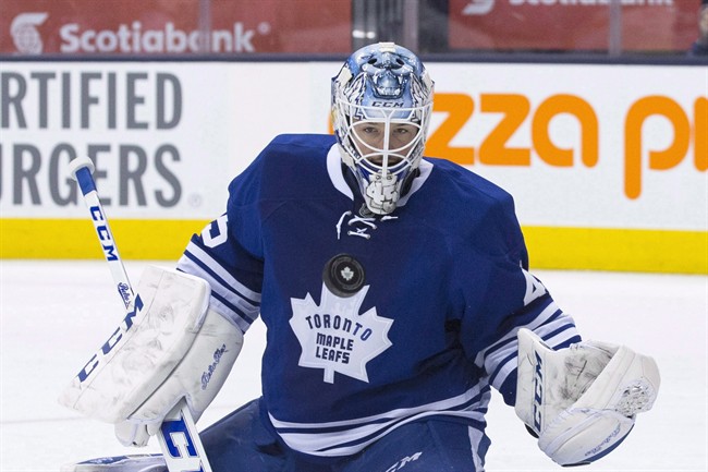 Toronto Maple Leafs goaltender Jonathan Bernier makes a save against Philadelphia Flyers during first period NHL hockey action in Toronto on Saturday, March 8, 2014. 