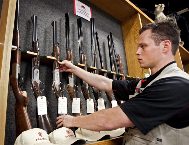 Patrick Deegan, a senior range officer, displays long guns at a gun store in Calgary, Wednesday, Sept. 15, 2010 in a photo taken to illustrate the debate at the time on Canada's long gun registry.
