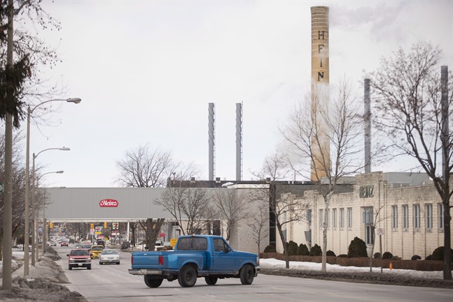 Cars drive past the Heinz plant in Leamington, Ontario.