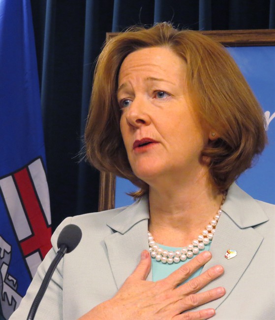 Alberta Premier Alison Redford speaks to reporters in Edmonton on Tuesday March 4, 2014. Redford revealed Tuesday that she spent taxpayers' money to fly her daughter's friends around on government aircraft, but says she will now pay back the $3,100 tab. THE CANADIAN PRESS/Dean Bennett.