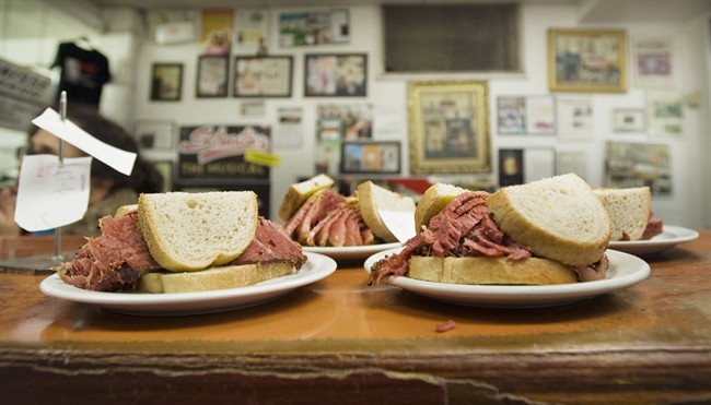 Smoked meat sandwiches sit on the counter at Schwartz's deli in Montreal, Thursday, March 8, 2012.