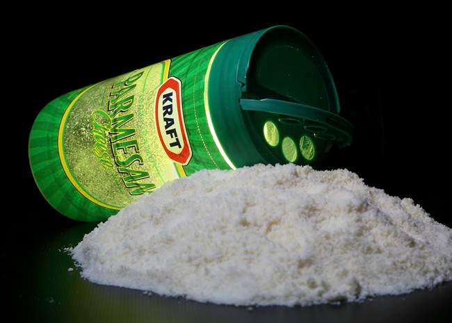 A package of Kraft parmesan cheese is seen in Washington, Tuesday, March 11, 2014. Looking for American-made parmesan cheese on the grocery aisle? If the European Union gets its way, you may not be able to find it. 