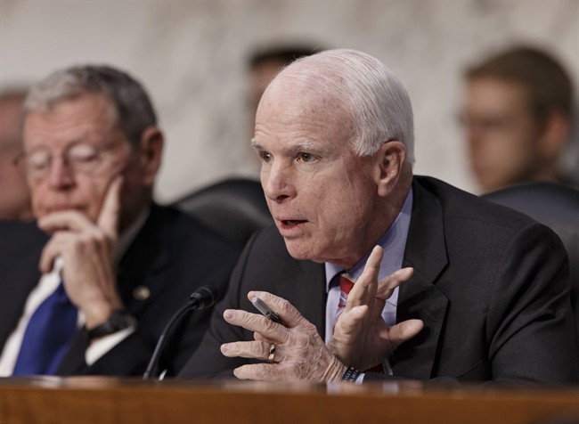 Sen. John McCain, R-Ariz., questions Defense Secretary Chuck Hagel on Capitol Hill in Washington, Wednesday, March 5, 2014.