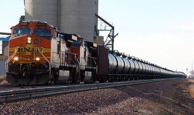 This Nov. 6, 2013 photo shows a BNSF Railway train hauling crude oil near Wolf Point, Mont. 