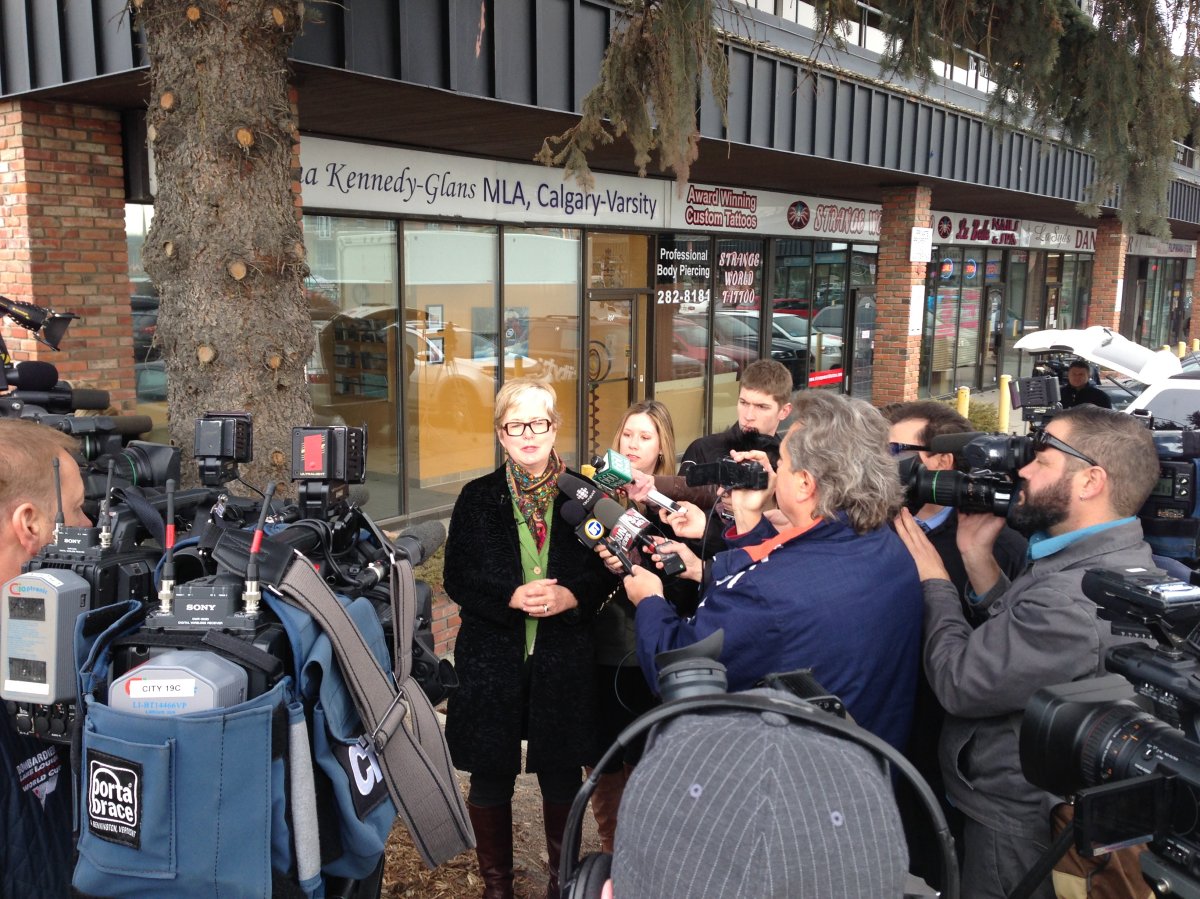 MLA Donna Kennedy-Glans speaks with reporters outside her constituency office in Calgary about her decision to resign from the PC caucus in March 2014.