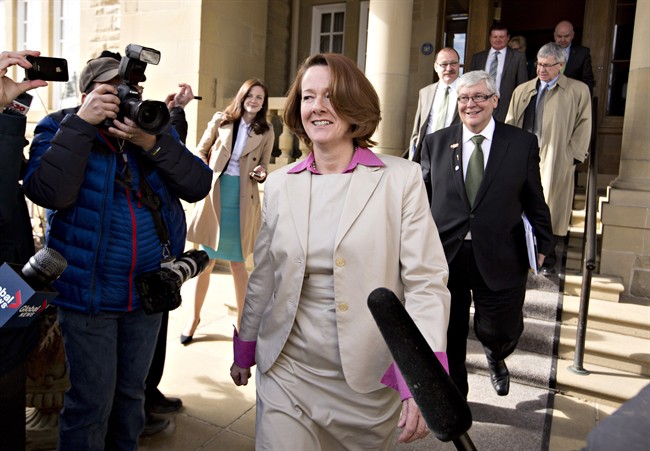 Alberta Premier Alison Redford leaves with members of her caucus after a meeting in Edmonton, Alberta on Monday March 17, 2014. 