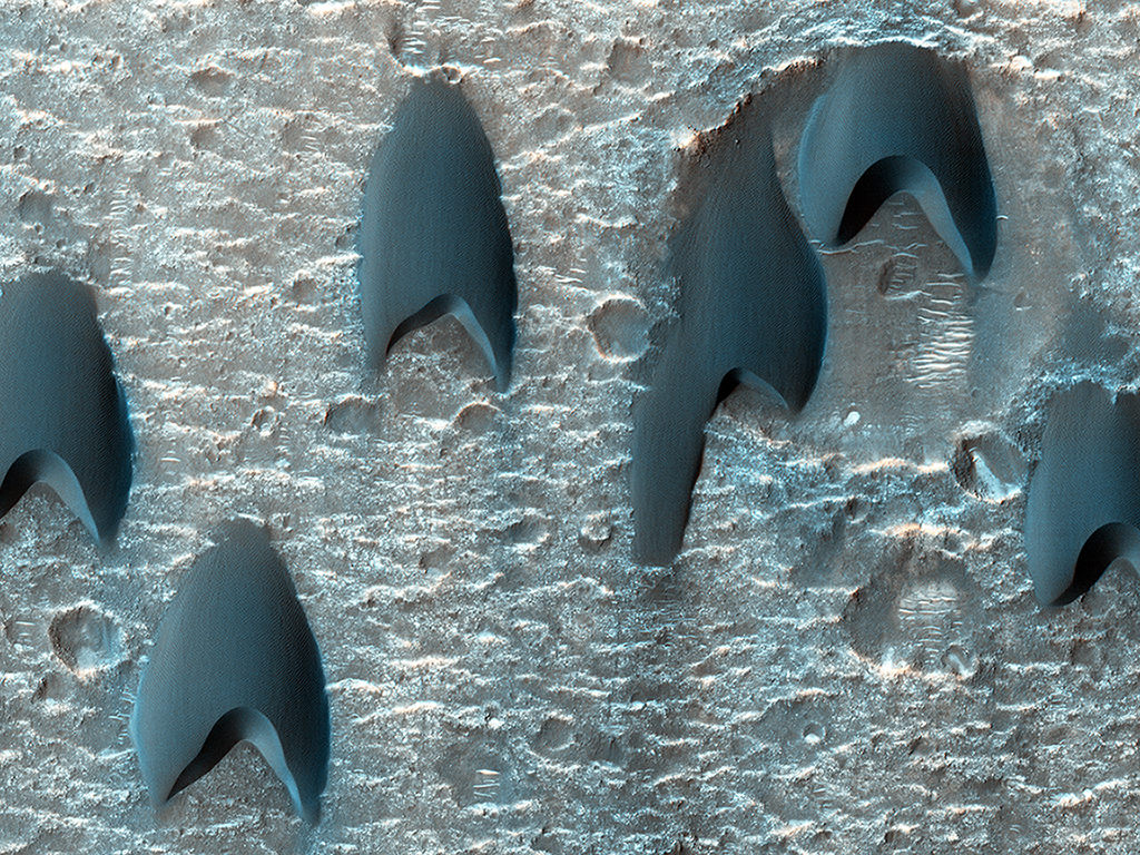 Beam me up. These unique sand dunes, reminiscent of the communicator badge used in the Star Trek franchise, lie in a large crater near Mawrth Vallis.