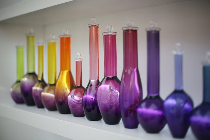 A line of coloured vases is shown at the Collect art fair at Saatchi Gallery on May 9, 2013 in London, England. 