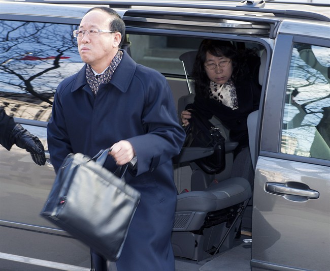 Slain York University student Liu Qian's father Liu Jianhui and mother Zheng Yaru (right) arrive at court in Toronto on Monday, March 24, 2014.