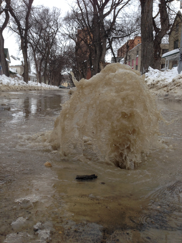 Water gushes from a break on Balmoral Street earlier this month. Another water main break has prompted the closure of John Henderson Junior High School.