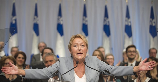 Parti Quebecois leader Pauline Marois speaks to delegates during a general council meeting in Laval, Que., Saturday, March 8, 2014 on day four of the Quebec provincial election campaign.