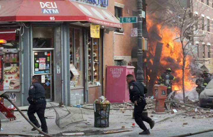 Emergency crews respond to an explosion that leveled two apartment buildings in the East Harlem neighborhood of New York, Wednesday, March 12, 2014.