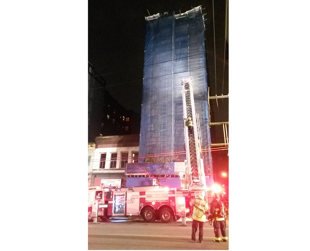 A building under renovation in the 100 block of East Hastings on fire.
