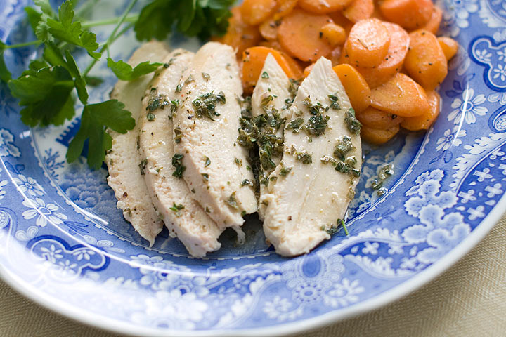 This March 3, 2014 photo shows simple roasted chicken with fresh herb sauce in Concord, N.H. 