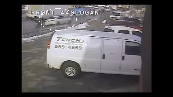 Image from video of woman's car being run off the road by a large white truck (circled) in Winnipeg on March 20, 2014 on Logan Avenue.