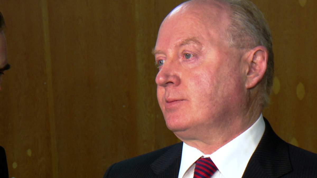 Ken Hughes speaks with media in Calgary on Monday, March 24, 2014.