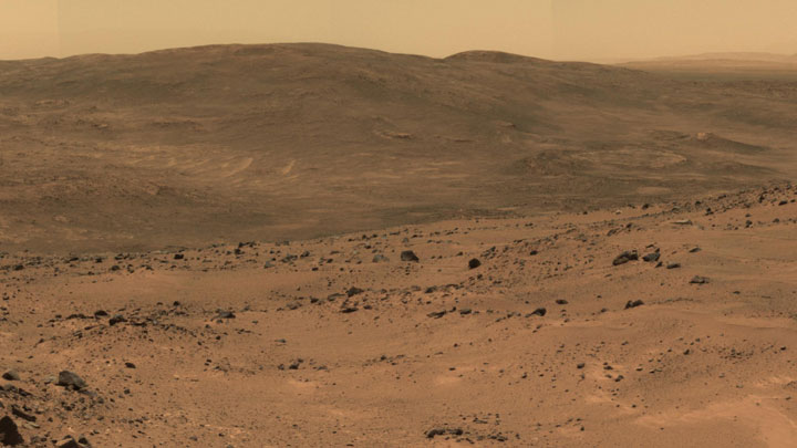 Husband Hill, as seen from NASA's rover Spirit (now out of service). At the top of this hill, Spirit found carbonate minerals, and also evidence of an ancient environment of hot springs or steam vents.