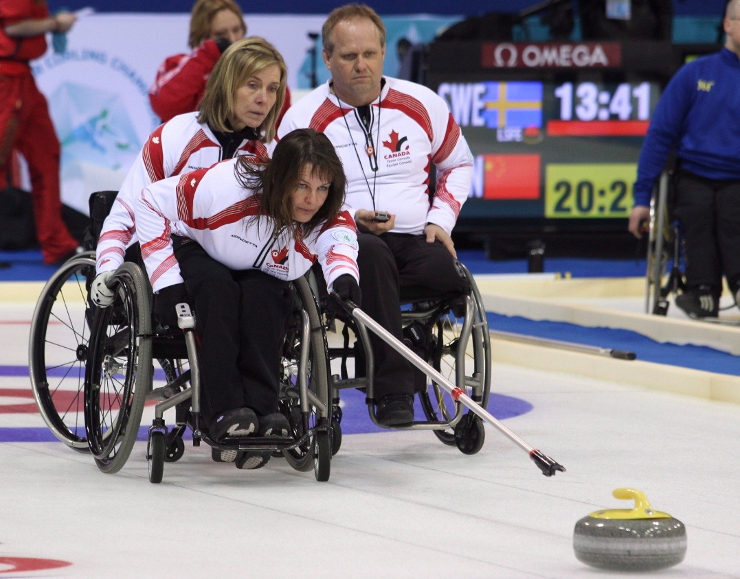 Canadian second Ina Forrest shot is watched by lead Sonja Gaudet and third Dennis Thiessen while playing Norway during the World Wheelchair Curling Championships at the Ice Cube Curling Centre in the Olympic Park in Sochi, Russia, Thursday, Feb. 21, 2013.Canadian second Ina Forrest shot is watched by lead Sonja Gaudet and third Dennis Thiessen while playing Norway during the World Wheelchair Curling Championships at the Ice Cube Curling Centre in the Olympic Park in Sochi, Russia, Thursday, Feb. 21, 2013.