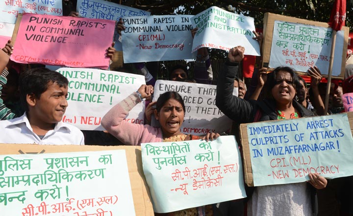 Supporters of the Communist Party of India (Marxist-Leninist) (CPI M-L) shout slogans during a demonstration against a gang rape in Muzafarnagar, in New Delhi on December 6, 2013.