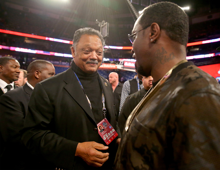The Reverend Jesse Jackson talks with Sean Combs after the Sprite Slam Dunk Contest 2014 as part of the 2014 NBA All-Star Weekend at the Smoothie King Center on February 15, 2014 in New Orleans, Louisiana. 