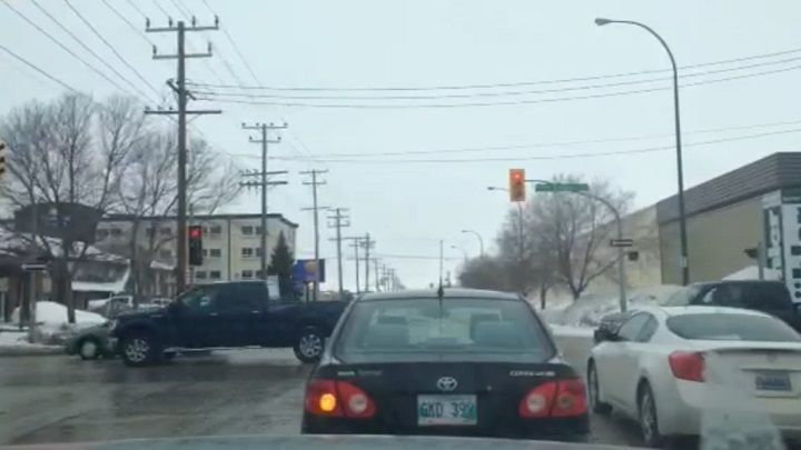 Traffic lights flashing red at King Edward St. and Sargent Ave.