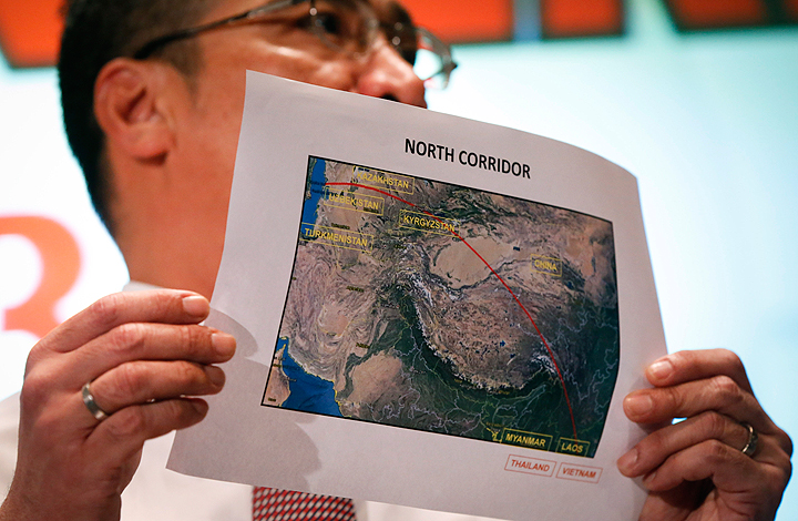 Malaysia's acting Transport Minister Hishamuddin Hussein shows the map of northern search corridor during a press conference at a hotel next to the Kuala Lumpur International Airport, in Sepang, Malaysia, Monday, March 17, 2014. 