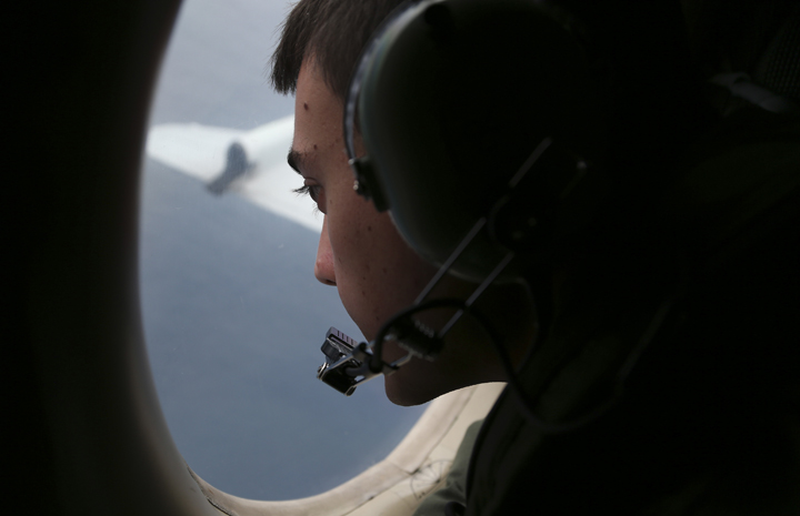 Sargent Matthew Falanga on board a Royal Australian Air Force AP-3C Orion, scans for debris or wreckage of missing Malaysian Airlines flight MH370 on March 22, 2014 in Southern Indian Ocean, off the west coast of Australia. 