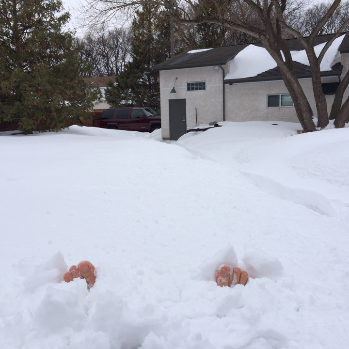 Greg MacKay's feet are buried by this winter's mountains of snow.