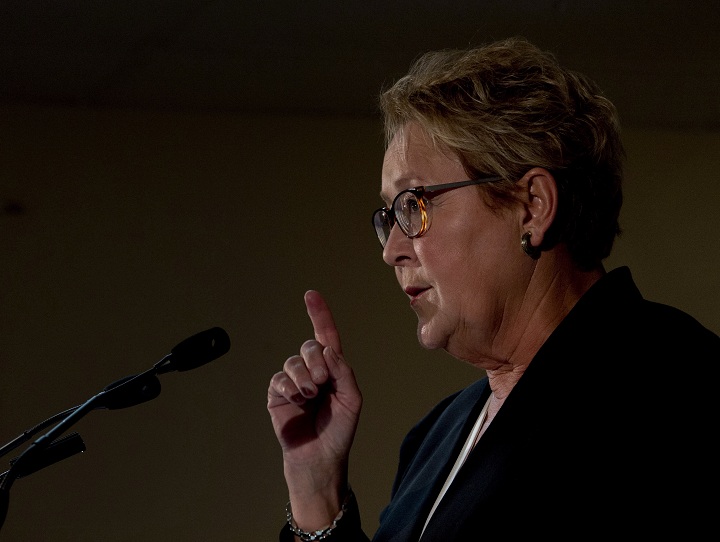Parti Quebecois leader Pauline Marois speaks to the media while campaigning Friday, March 7, 2014 in Blainville, Que. Quebecers will vote in a provincial election April 7, 2014.