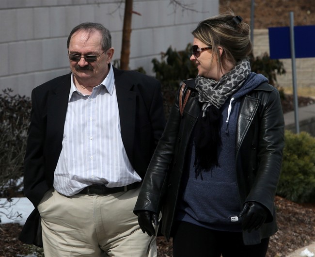 John Leonard MacKean and his daughter arrive at court on Monday, March 17, 2014 in Bridgewater, Nova Scotia. MacKean is charged with sexual assault in the case of a teenage boy who was allegedly confined inside a Nova Scotia cabin.