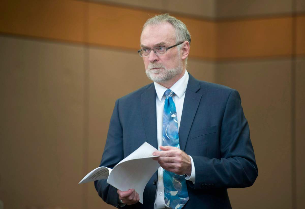 Auditor general Michael Ferguson waits to appear at Commons transport committee on Wednesday December 4, 2013 in Ottawa. THE CANADIAN PRESS/Adrian Wyld.