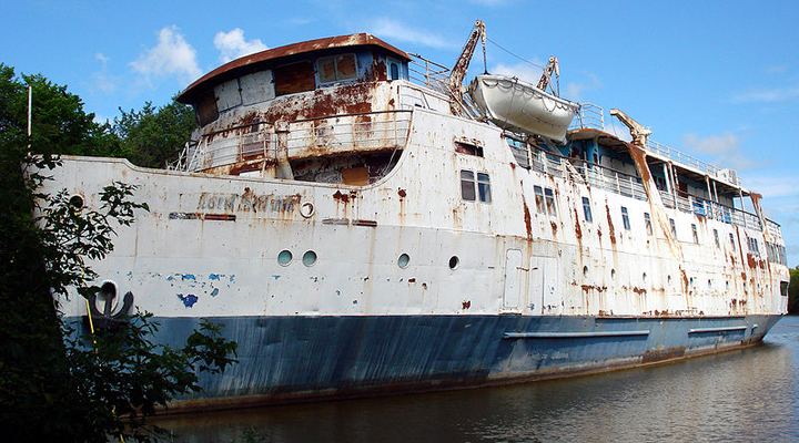 The MS Lord Selkirk lists in a Selkirk slough in July 2010. The ship caught fire in 2012 but remains in the water in Selkirk Park.