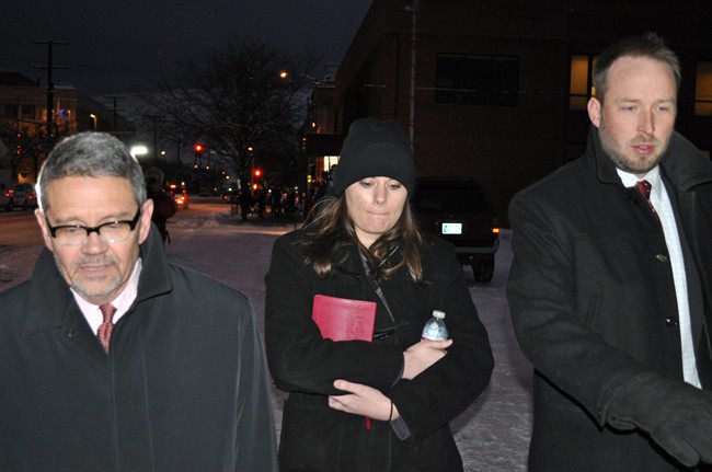  In this Tuesday, Dec. 10, 2013 file photo, Jordan Graham, center, is flanked by defense attorneys Michael Donahoe, left, and Andy Nelson, as she leaves court in Missoula, Mont. 
