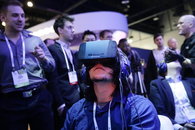  Attendees play a video game wearing Oculus Rift virtual reality headsets at the Intel booth at the International Consumer Electronics Show(CES), in Las Vegas.