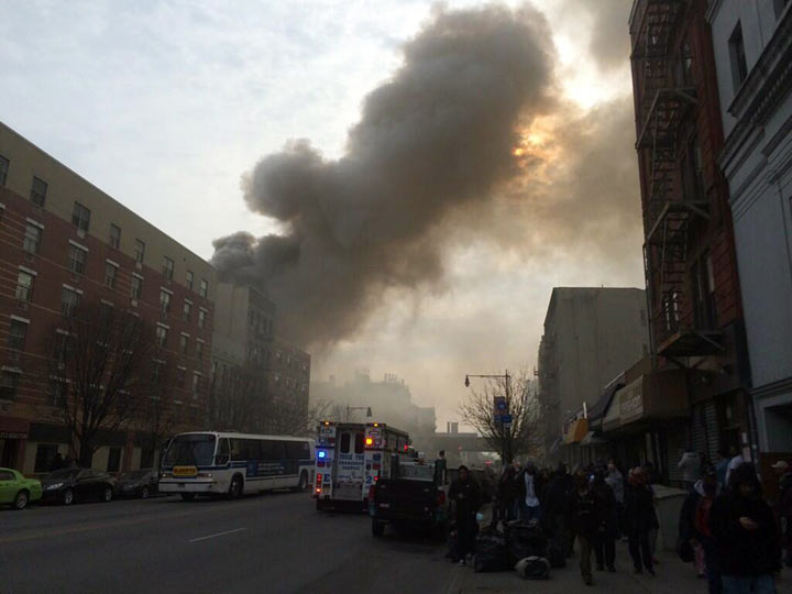 In this photo provided by Shane Kennedy, smoke rises from the site of an explosion and building collapse near Park Avenue and 116th Street in the East Harlem neighborhood of New York, Wednesday, March 12, 2014.