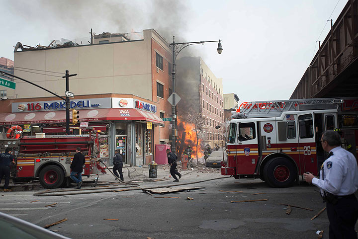 Emergency crews respond to an explosion and building collapse in the East Harlem neighborhood of New York, Wednesday, March 12, 2014.