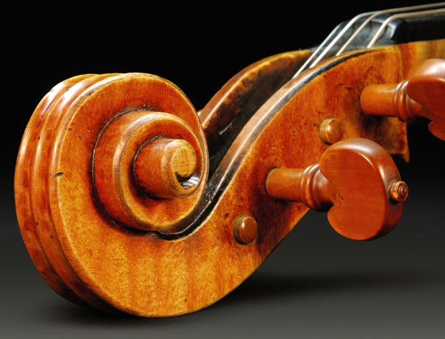 This undated photo provided by Sotheby's shows a detail of a rare 1719 Stradivarius.