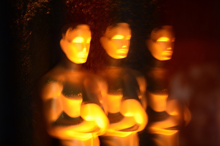 An Oscar statue is reflected in glass outside the Academy of Motion Picture Arts and Sciences (AMPAS) Foreign Language Film nominees cocktail reception in Los Angeles on February 28, 2014. 