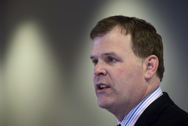 In this FILE photo, Foreign Affairs Minister John Baird reads a statement regarding the situation in Ukraine, Tuesday, March 18, 2014 in Montreal. T.