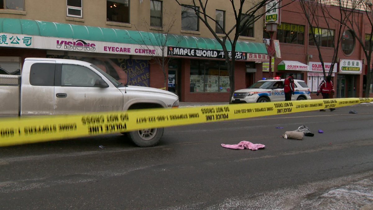 Police investigate after a pedestrian was killed at a downtown crosswalk on Sunday.