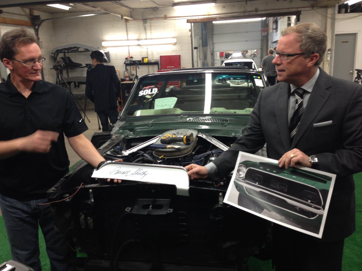 Premier Brad Wall and Patrick Mengel, owner of Advanced Collision, show  on Monday how the car will eventually look like.