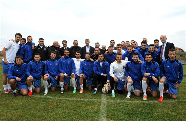 Kosovo’s national soccer team ahead of its first-ever international friendly soccer match in the town of Obilic, Kosovo, Tuesday, March 4, 2014. (AP Photo/Visar Kryeziu)