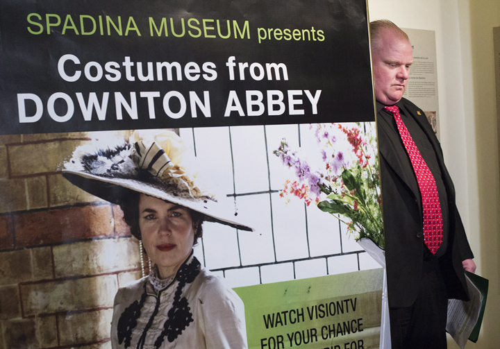 Toronto Mayor Rob Ford waits to speak at the media preview for the Canadian launch of the "Dressing for Downton: Costumes from Downton Abbey" exhibit at the Toronto Spadina Museum