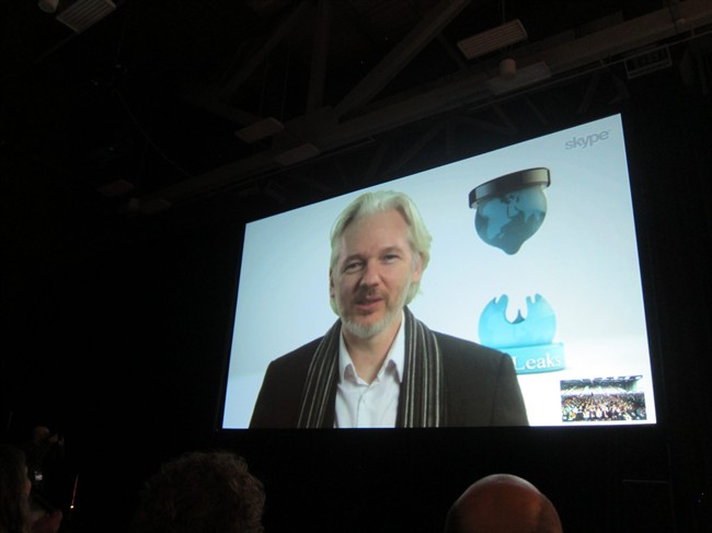 WikLeaks founder Julian Assange speaks via Skype at the South By SouthWest Interactive festival in Austin, Texas, Saturday, March 8, 2014. 