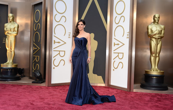 Nominee for Best Actress in ‘Gravity’ Sandra Bullock arrives on the red carpet for the 86th Academy Awards on March 2nd, 2014 in Hollywood, California.