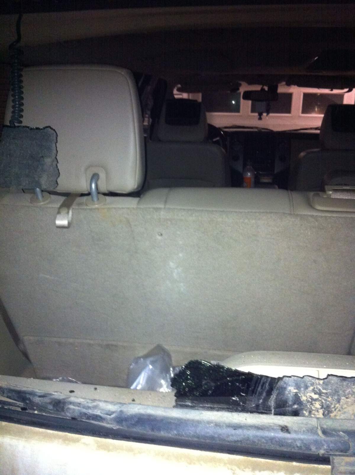 Bullet hole in the back seat of the SUV.
