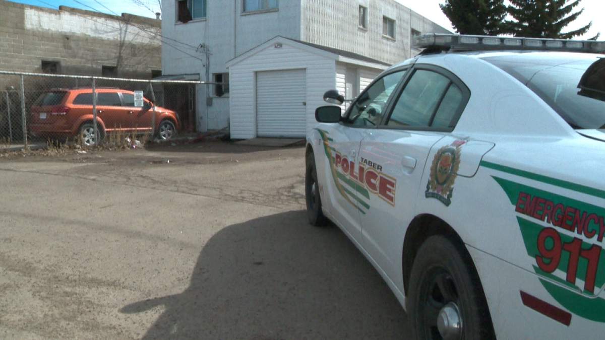Police investigate the death of a man in Taber, Alberta, Saturday, March 15, 2014.