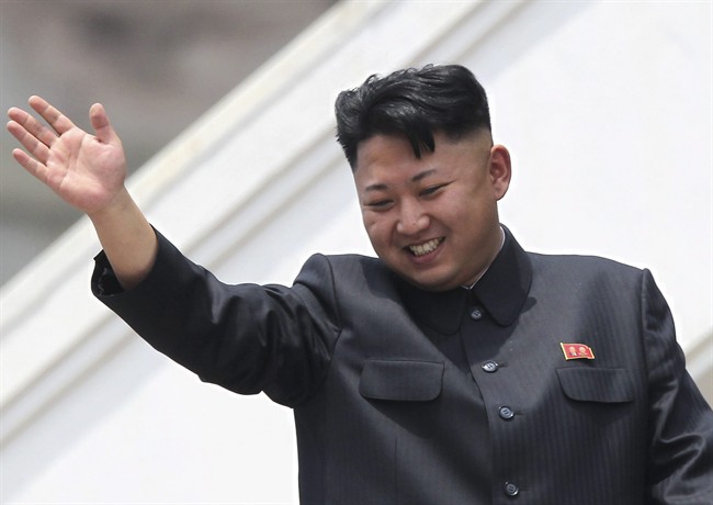 FILE - In this July 27, 2013 file photo, North Korean leader Kim Jong Un waves to war veterans during a mass military parade celebrating the 60th anniversary of the Korean War armistice in Pyongyang, North Korea. 