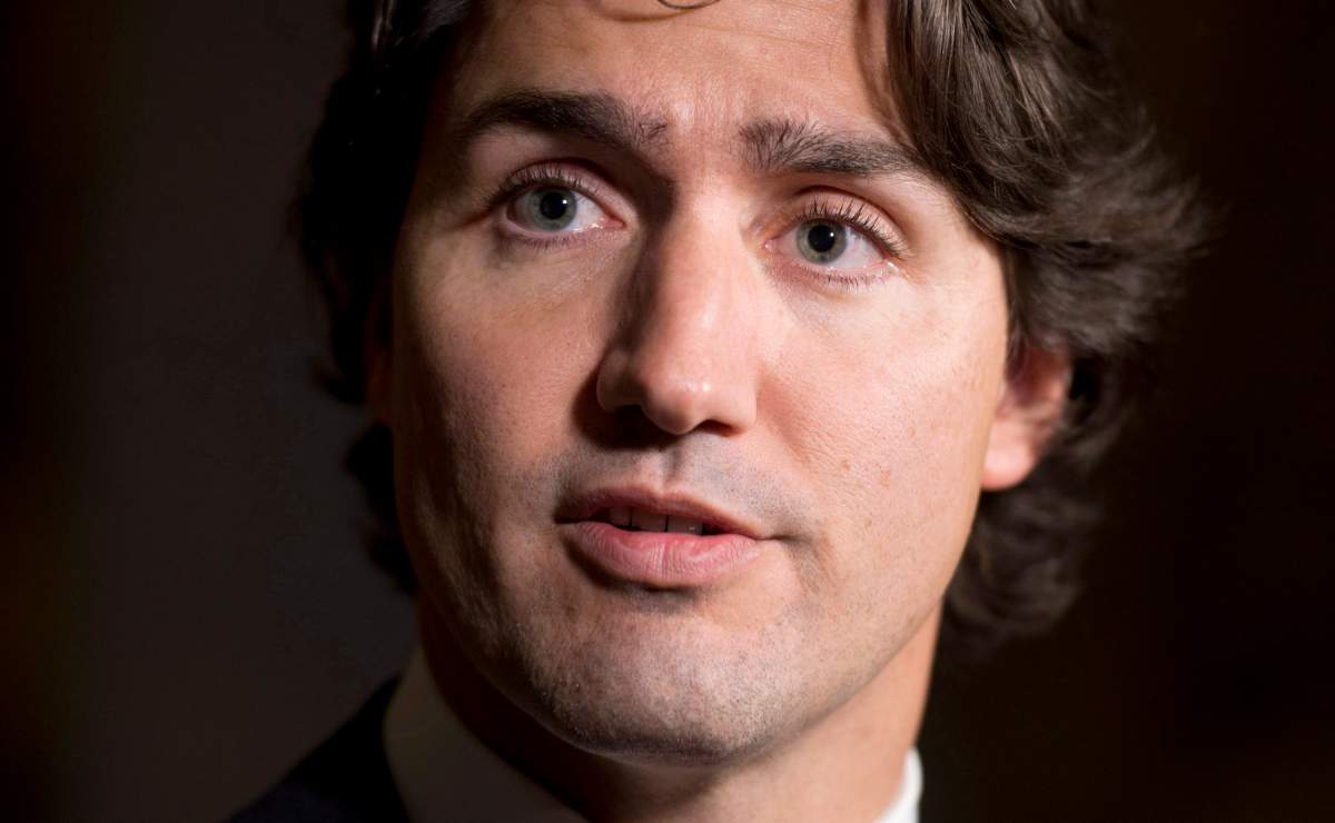 Liberal leader Justin Trudeau speaks with the media following party caucus meetings on Parliament Hill Wednesday November 6, 2013 in Ottawa. THE CANADIAN PRESS/Adrian Wyld.